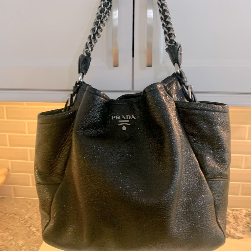 Beautiful Prada purse slight metalic black color